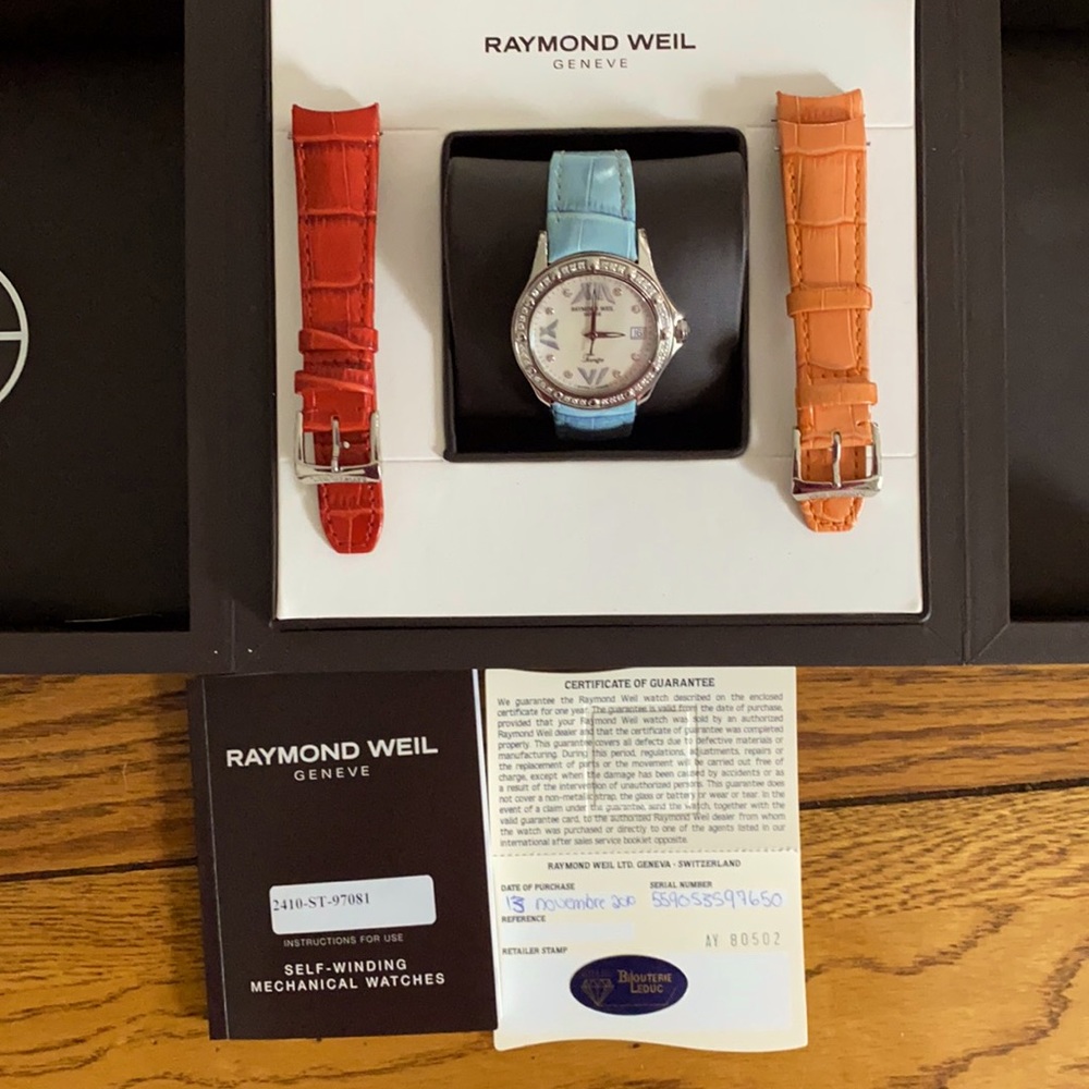 Ladies new, never worn Raymond Weil watch with two additional watch bands.